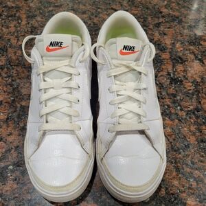 Nike White Sneakers with Classic Design and Textured Fabric